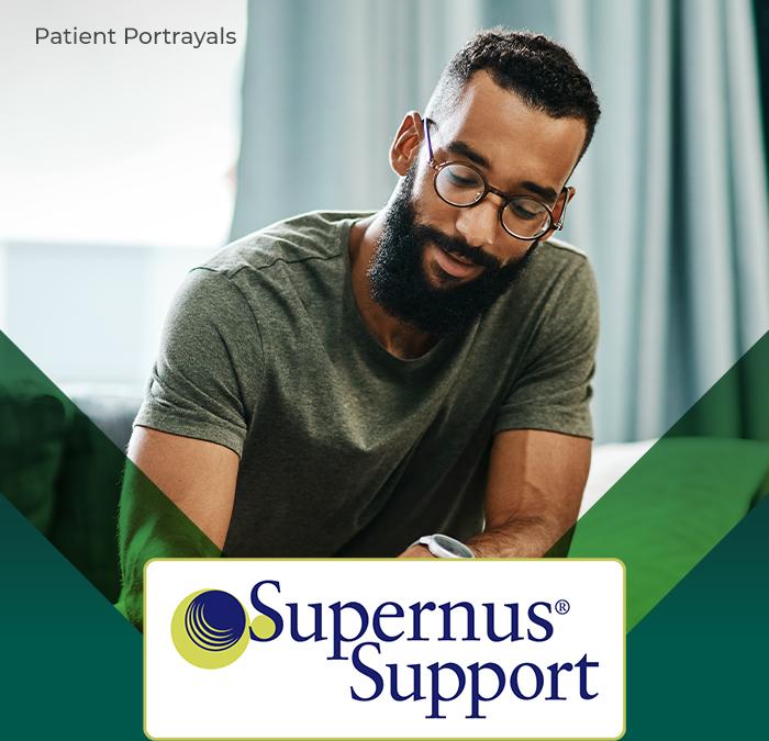 man writing, with Supernus Support logo in the corner